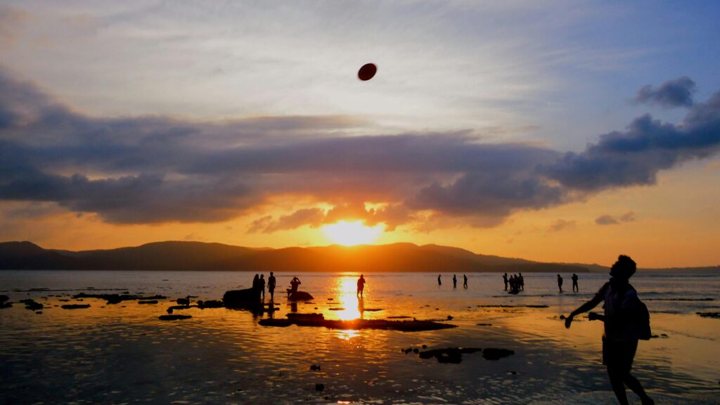 pexels-photo-362690-362690 Silhouettes of people enjoying a sunset at a picturesque beach in Port Blair, India.